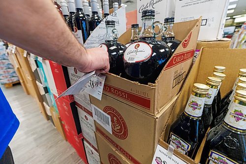 MIKE DEAL / FREE PRESS
Liquor store employees put the final touches on the display of American liqour that will be going on sale at the Crestview MLCC Wednesday morning.
Reporter: Scott Billeck
251210 - Wednesday, December 10, 2025.