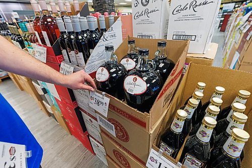 MIKE DEAL / FREE PRESS
Liquor store employees put the final touches on the display of American liqour that will be going on sale at the Crestview MLCC Wednesday morning.
Reporter: Scott Billeck
251210 - Wednesday, December 10, 2025.