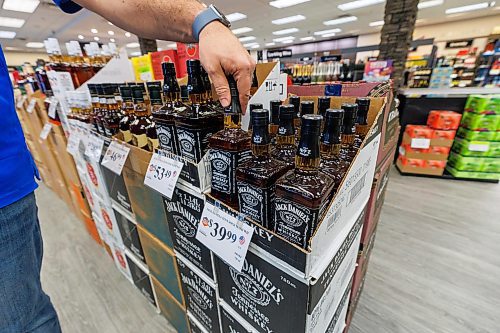 MIKE DEAL / FREE PRESS
Liquor store employees put the final touches on the display of American liqour that will be going on sale at the Crestview MLCC Wednesday morning.
Reporter: Scott Billeck
251210 - Wednesday, December 10, 2025.