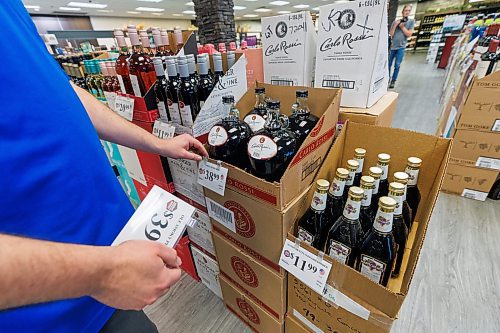 MIKE DEAL / FREE PRESS
Liquor store employees put the final touches on the display of American liqour that will be going on sale at the Crestview MLCC Wednesday morning.
Reporter: Scott Billeck
251210 - Wednesday, December 10, 2025.