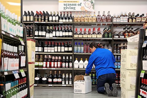 10122025
Roberta Rosen with the Manitoba Liquor Mart on 10th Street and Victoria Avenue helps stock American alcohol onto shelves at the retailer on Wednesday morning. The American alcohol in stock is available to purchase while supplies last or until December 24th, and is only available in Brandon at the Victoria Avenue Manitoba Liquor Mart location. Manitoba Liquor and Lotteries Corporation stopped selling American alcohol in February in response to tariffs imposed by U.S. President Donald Trump. Proceeds from the sale of US alcohol over the next two weeks will go to local and provincial charities and food banks. 
(Tim Smith/The Brandon Sun)