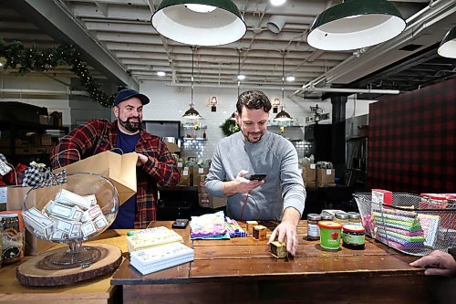 Ruth Bonneville / Free Press 

BIZ - Farmer's Son

Photo of of Dan Mitchell, founder and owner of Farmer's Son Co. (right) and Rory Brennan as they ring through a customers items at the till,  

Farmer's Son Co. sells  classic homemade  candles along with many other items including specialty chocolate bars, kitchen linens and much more.  

This is for the Dec. 8 'Made in Manitoba' article. 


Dec 3rd, 2025
