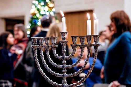 JOHN WOODS / WINNIPEG FREE PRESS
Police were on hand when Winnipeg mayor Scott Gillingham and Rabbi Avrohom Altein light the menorah on the second night of Hanukkah at City Hall Monday, December 15, 2025. 

reporter: chris and scott