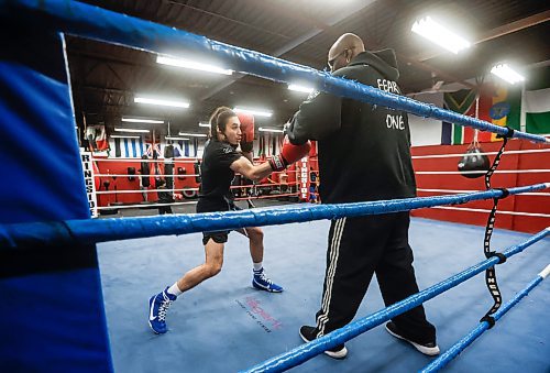 JOHN WOODS / WINNIPEG FREE PRESS
Isaiah Rock trains with coach Jerome Peters at Powers Boxing Club Monday, December 15, 2025. Rock won gold at the nationals and will be boxing in Spain at a major event.
reporter: taylor