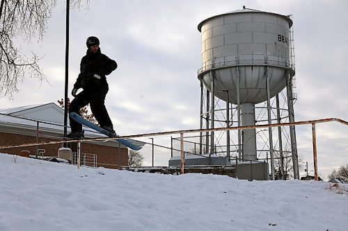 Alex Hall, a professional skier, grinds a handrail in Rideau Park. (Connor McDowell/Brandon Sun)