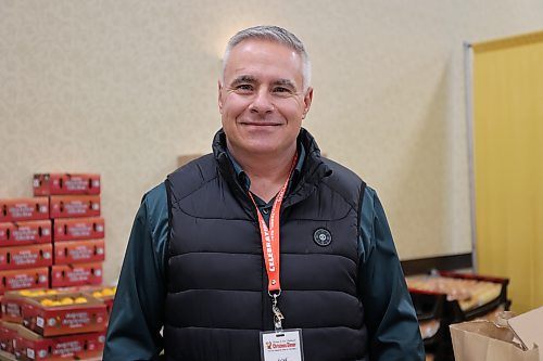 Volunteer Terry Browett was responsible for organizing people who were packaging and delivering about 1,500 meals for the Westman and Area Traditional Christmas Dinner on Dec. 25, 2025. (Tessa Adamski/The Brandon Sun)