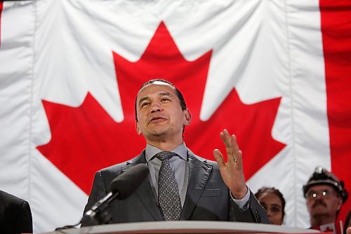 The Maple Leaf Flag hangs behind Manitoba premier Wab Kinew at the Maple Leaf Foods plant cafeteria on Wednesday afternoon as he announces more than $150 million in supports for Manitoba producers, including $10 million to match federal AgriStability funding. (Matt Goerzen/The Brandon Sun)