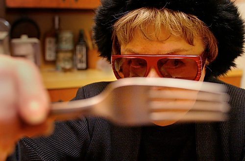 JOE BRYKSA/WINNIPEG FREE PRESS Detour-(see Carolin story)- Free Press restaurant reviewer Marion Warhaft wears a disguise as she poses for a photo for upcoming Detour Q@A-Jan 06, 2004