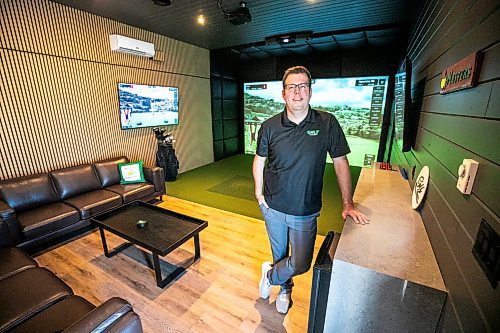 MIKAELA MACKENZIE / FREE PRESS

Lucas Mlinar, founder of Golf Haven (a new business that builds golf simulator sheds and does commercial golf simulator installations), in an example build on Wednesday, Dec. 31, 2025.

For Aaron story.
Free Press 2025