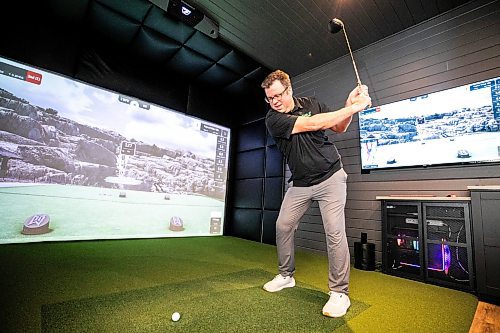 MIKAELA MACKENZIE / FREE PRESS

Lucas Mlinar, founder of Golf Haven (a new business that builds golf simulator sheds and does commercial golf simulator installations), in an example build on Wednesday, Dec. 31, 2025.

For Aaron story.
Free Press 2025