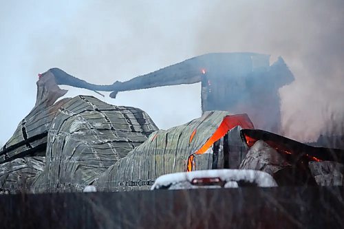 A fire burns at a storage and equipment shop owned by Full Tilt Towing at Transport at 49th Street East on Saturday morning. No one was injured in the blaze. (Matt Goerzen/The Brandon Sun)