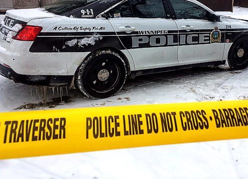 BORIS MINKEVICH / WINNIPEG FREE PRESS
Winnipeg Police Service sit on the crime scene where someone was shot on Aikins Street near Mountain Ave. The shooting took place at about 4 a.m. at a home in the 300 block of Aikins Street. WPS. Police Car. Squad. Tape. Dec. 16, 2017