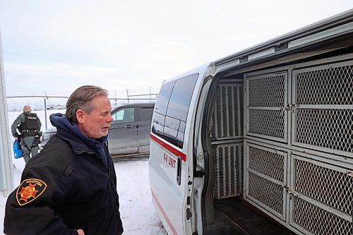 Jay Palmer, K9 program co-ordinator for the Province of Manitoba, opens his work van at the practical training site of the Manitoba Emergency Services College. The van has been customized to hold eight kennels for dogs. (Connor McDowell/The Brandon Sun)