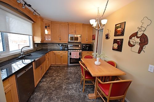Todd Lewys / Free Press
Updates abound in the eat-in kitchen, from maple cabinets to granite countertops as well as a tile backsplash and newer stainless-steel appliances.
