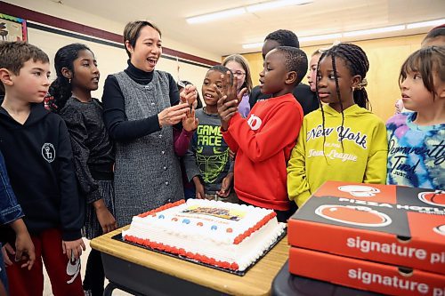 06012025
Wing Chow, Music Teacher at École New Era School, cuts a cake with her grade three music students to celebrate their first place culture award win in the CBC Music Challenge - Fall 2025 Edition. The New Era grade three classes submission was selected as one of the winners from over 400 entires and was the only Manitoba school winner. The grade three students celebrated with pizza and cake on Tuesday. 
(Tim Smith/The Brandon Sun)
