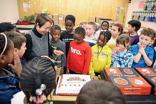 06012025
Wing Chow, Music Teacher at École New Era School, cuts a cake with her grade three music students to celebrate their first place culture award win in the CBC Music Challenge - Fall 2025 Edition. The New Era grade three classes submission was selected as one of the winners from over 400 entires and was the only Manitoba school winner. The grade three students celebrated with pizza and cake on Tuesday. 
(Tim Smith/The Brandon Sun)