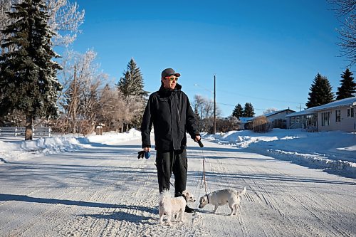 Darren More walks his dogs Saffy and Trix near his home in Virden on Wednesday. (Tim Smith/The Brandon Sun)
