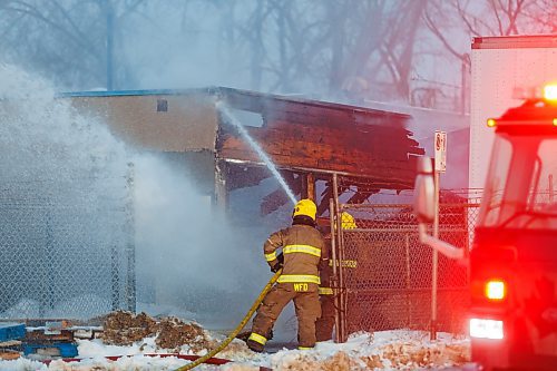 MIKE DEAL / FREE PRESS
WFPS crews work at putting out a fire at 45 Archibald Street Thursday morning.
Brad Mazer, acting district chief with WFPS, held a brief media scrum, saying they were called to the scene around 3:30 a.m. from police who were already there.
They will be dealing with the fire until close to the noon hour.
There were reports of flammable liquids, and because the fire was well involved they decided to fight it defensively.
Significant damage to the building but no official damage estimate.
No one was inside the building.
260108 - Thursday, January 08, 2026.