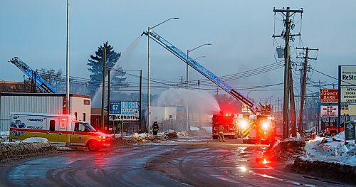 MIKE DEAL / FREE PRESS
WFPS crews work at putting out a fire at 45 Archibald Street Thursday morning.
Brad Mazer, acting district chief with WFPS, held a brief media scrum, saying they were called to the scene around 3:30 a.m. from police who were already there.
They will be dealing with the fire until close to the noon hour.
There were reports of flammable liquids, and because the fire was well involved they decided to fight it defensively.
Significant damage to the building but no official damage estimate.
No one was inside the building.
260108 - Thursday, January 08, 2026.