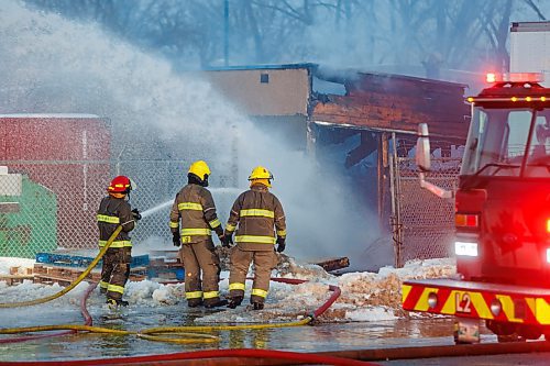 MIKE DEAL / FREE PRESS
WFPS crews work at putting out a fire at 45 Archibald Street Thursday morning.
Brad Mazer, acting district chief with WFPS, held a brief media scrum, saying they were called to the scene around 3:30 a.m. from police who were already there.
They will be dealing with the fire until close to the noon hour.
There were reports of flammable liquids, and because the fire was well involved they decided to fight it defensively.
Significant damage to the building but no official damage estimate.
No one was inside the building.
260108 - Thursday, January 08, 2026.