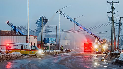 MIKE DEAL / FREE PRESS
WFPS crews work at putting out a fire at 45 Archibald Street Thursday morning.
Brad Mazer, acting district chief with WFPS, held a brief media scrum, saying they were called to the scene around 3:30 a.m. from police who were already there.
They will be dealing with the fire until close to the noon hour.
There were reports of flammable liquids, and because the fire was well involved they decided to fight it defensively.
Significant damage to the building but no official damage estimate.
No one was inside the building.
260108 - Thursday, January 08, 2026.