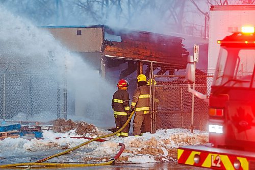 MIKE DEAL / FREE PRESS
WFPS crews work at putting out a fire at 45 Archibald Street Thursday morning.
Brad Mazer, acting district chief with WFPS, held a brief media scrum, saying they were called to the scene around 3:30 a.m. from police who were already there.
They will be dealing with the fire until close to the noon hour.
There were reports of flammable liquids, and because the fire was well involved they decided to fight it defensively.
Significant damage to the building but no official damage estimate.
No one was inside the building.
260108 - Thursday, January 08, 2026.