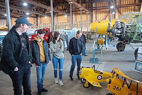 In this 2024 picture, Andrew Hayter (from left) gives friends Jonas Kusmizkij, Mikayla Cox and Tyson Andrew a tour of the Commonwealth Air Training Plan Museum. A recent legacy gift of $1.6 million will help tell the story to younger generations, the museum announced Friday. (Tim Smith/The Brandon Sun files)
