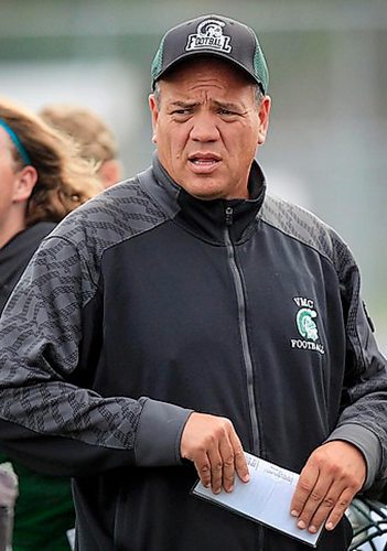 PHIL HOSSACK / WINNIPEG FREE PRESS -  Vincent Massey coach Kelsey McKay surrounded by his team at a workout wednesday afternoon. Jason Bell Story. September 7, 2016