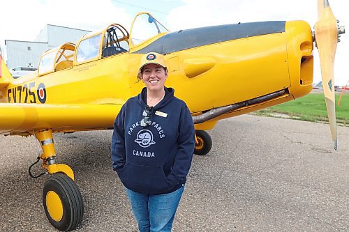 Air museum director general Zoe McQuinn stands by a Second World War training aircraft. (The Brandon Sun files)