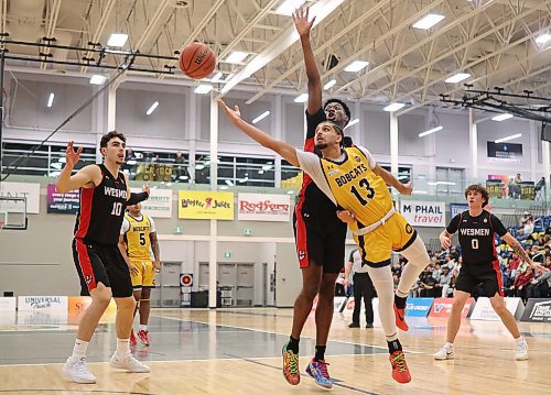 Munroop Gill of the Brandon Bobcats takes an off-balance layup against the Winnipeg Wesmen during Canada West men's basketball action at the HLC on Friday. (Tim Smith/The Brandon Sun)