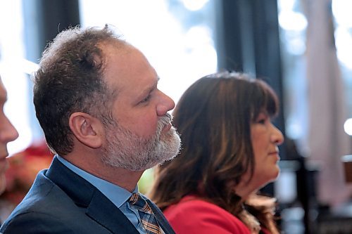Manitoba Justice Minister Matt Wiebe listens to comments by Brandon Police Chief Tyler Bates while sitting beside Housing, Addictions and Homelessness Minister Bernadette Smith during a press conference at Brandon City Hall on Friday morning. (Matt Goerzen/The Brandon Sun)