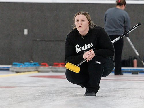 Jennah Derksen watches her teammates sweep after delivering a rock during the women's A-side championship. (Massimo De Luca-Taronno/The Brandon Sun)