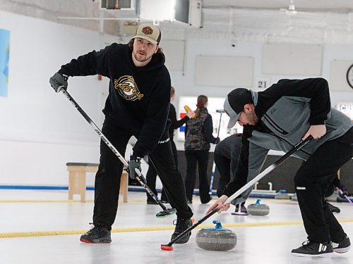 Justin and Austin West sweep away during the men's A-side championship. (Massimo De Luca-Taronno/The Brandon Sun)