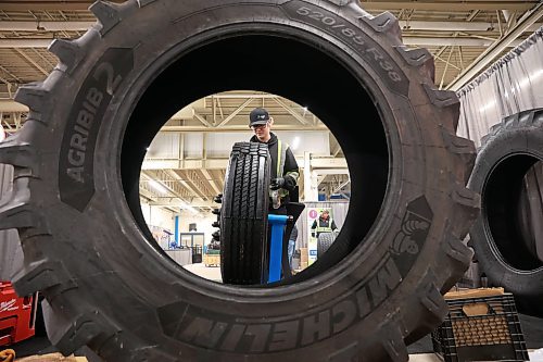 19012026
Logan Craig with Denray Tire in Brandon polishes a tire while preparing the Denray Tire booth at the Keystone Centre on Monday ahead of Manitoba Ag Days 2026. Ag Days opens today and runs until Thursday.
(Tim Smith/The Brandon Sun)