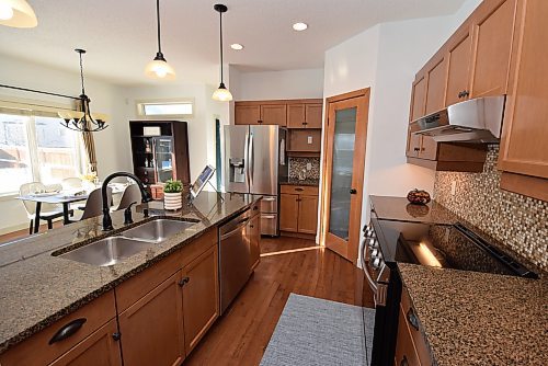 Todd Lewys / Free Press
Maple cabinetry, granite countertops and stainless-steel appliances combine to give the peninsula-style kitchen a wonderfully contemporary feel.