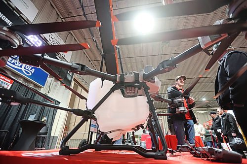 20012026
Todd Fraser with Flaman speaks with a visitor to Manitoba Ag Days 2026 about the uses for a DJI Agras T100 drone on display at the Flaman booth on Tuesday. 
(Tim Smith/The Brandon Sun)