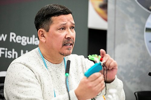 MIKAELA MACKENZIE / FREE PRESS

Tataskweyak Cree Nation knowledge keeper Robert Spence shows sturgeon tagging equipment at a press conference about Manitoba Hydroճ negative impact on sturgeon in the Churchill River on Thursday, Jan. 22, 2026.

For Chris story.
Free Press 2026