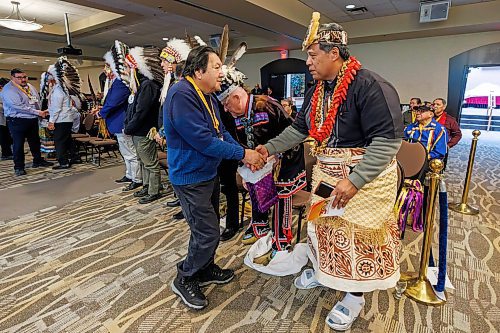 MIKE DEAL / FREE PRESS
Fred Harper, Elijah Harper brother, shakes hands with Chief Tuifa’asisina Vaeluaga Eli who is from the Royal Family of Samoa a Polynesian Nation in the South Pacific, after making a speech.
Chiefs arrive for the Roll Call of the Nations to kick off the start of the 30th anniversary of the Sacred Assembly which is being held at the Canad Inns Destination Centre Polo Park January 23-25.
In 1995, Elijah Harper organized a national Sacred Assembly in Hull, Quebec. It had a focus on spiritual reconciliation, healing, and justice between First Nations, Inuit, Métis and non-Indigenous peoples. It brought together 3,000 people from across Canadian society--Indigenous leaders, elders, youth, and community representatives, spiritual leaders from various faith traditions and political leaders at federal, provincial, and municipal levels. One of the most tangible outcomes associated with the Sacred Assembly was the momentum it helped generate for National Aboriginal Day (June 21). 
260123 - Friday, January 23, 2026.
