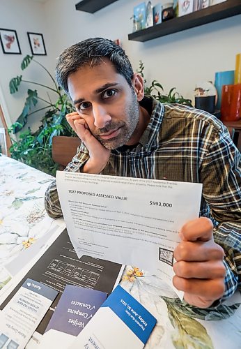 JOHN WOODS / WINNIPEG FREE PRESS
Jeremy Dias, who is looking at his recent city property assessment which states that his home has gone up $193,000 from the last assessment, is photographed in his home Tuesday, February 3, 2026.
reporter: joyanne