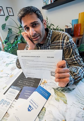 JOHN WOODS / WINNIPEG FREE PRESS
Jeremy Dias, who is looking at his recent city property assessment which states that his home has gone up $193,000 from the last assessment, is photographed in his home Tuesday, February 3, 2026.
reporter: joyanne