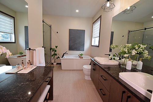 Todd Lewys / Free Press
True relaxation awaits in the luxurious ensuite, which comes equipped with a soaker tub, tiled walk-in shower, makeup station and maple vanity with dual raised sinks.