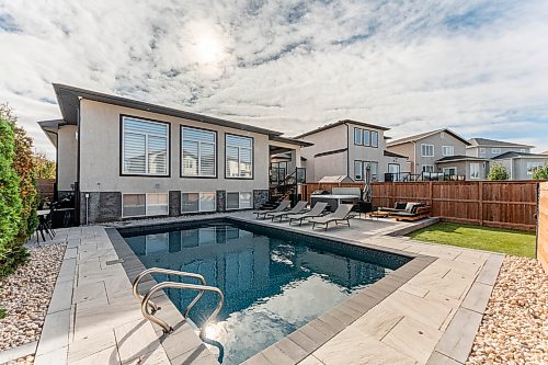 Todd Lewys / Free Press
The large, fenced backyard is a private retreat, offering a hot tub, barbecue area and an in-ground pool with adjacent patio space.