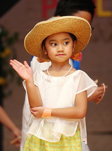 A young girl performs a traditional dance at the Philippines pavilion, hosted at Knox United Church on Friday evening, as part of the Westman Multicultural Festival. (Matt Goerzen/The Brandon Sun)