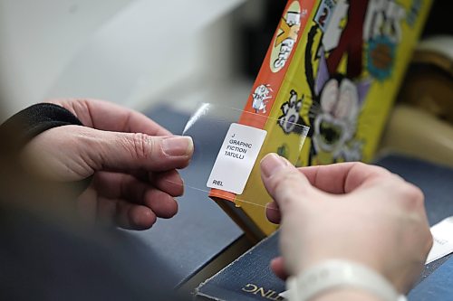 Ruth Bonneville / Free Press 

ENT - BTS library

Place: Millennium Library

Photo of new books being labelled. 

Meeting up with  Aileen Clear, collections librarian for the city, for a Behind the Scenes feature on how the library procures books/ebooks/audiobooks and how it predicts popularity to meet demand 

Story by Eva Wasney

Feb 5th,  2026