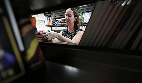 Ruth Bonneville / Free Press
ENT - BTS library
Place: Millennium Library
Photo of Aileen Clear, collections librarian at the Millennium Library looking through new books that are sorted on shelves prior to being placed in libraries.
Meeting up with Aileen Clear, collections librarian for the city, for a Behind the Scenes feature on how the library procures books/ebooks/audiobooks and how it predicts popularity to meet demand
Story by Eva Wasney
Feb 5th, 2026