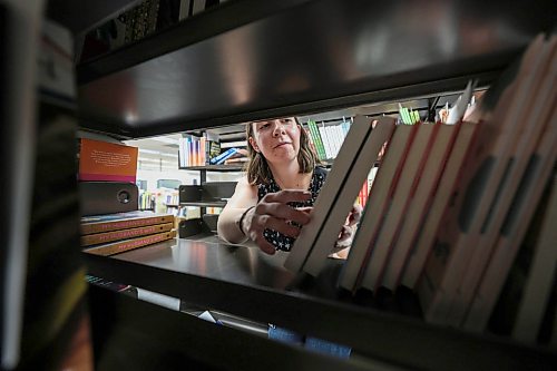 Ruth Bonneville / Free Press 

ENT - BTS library

Place: Millennium Library

Photo of Aileen Clear, collections librarian at the Millennium  Library looking through new books that are sorted on shelves prior to being placed in libraries.

Meeting up with Aileen Clear, collections librarian for the city, for a Behind the Scenes feature on how the library procures books/ebooks/audiobooks and how it predicts popularity to meet demand 

Story by Eva Wasney

Feb 5th,  2026