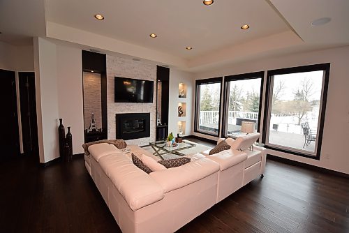Todd Lewys / Free Press
Defined by a stylish tray ceiling and three floor-to-ceiling windows, the great room also gfeatures a gorgeous gas fireplace with quartzite stone surround.