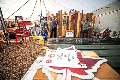 MIKAELA MACKENZIE / FREE PRESS

Stephane Poirier (left), Sol Desharnais, and Lionel Cur set up the maple taffy area, run by the St-Pierre-Jolys Museum since 1991, during Festival du Voyageur preparations at Fort Gibraltar on Wednesday, Feb. 11, 2026.


Standup.
Free Press 2026