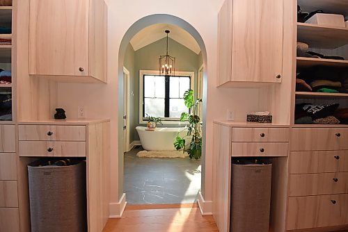 Todd Lewys / Free Press
An artistic arched entrance leads into the spa-like ensuite from a large walk-in closet that offers tons of custom storage.