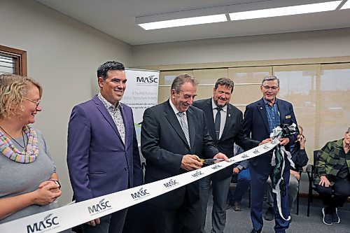 In this file photo, Agriculture Minister Ron Kostyshyn cuts the ribbon at Virden's new MASC office at a grand-opening event on Friday afternoon. Mayor Tina Williams (from left), RM of Wallace-Woodworth Reeve Clayton Canart, Municipal and Northern Relations Minister Glen Simard, and MASC chair John Plohman. (Connor McDowell/The Brandon Sun file)